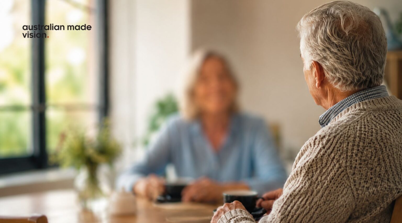 Older man looking towards a blurred person, illustrating how macular degeneration may affect central vision and face recognition