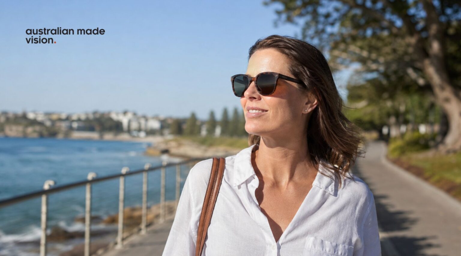 Woman wearing prescription sunglasses while walking outdoors on a sunny day in Australia.